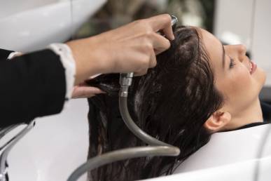 woman getting treatment hairdresser shop 1